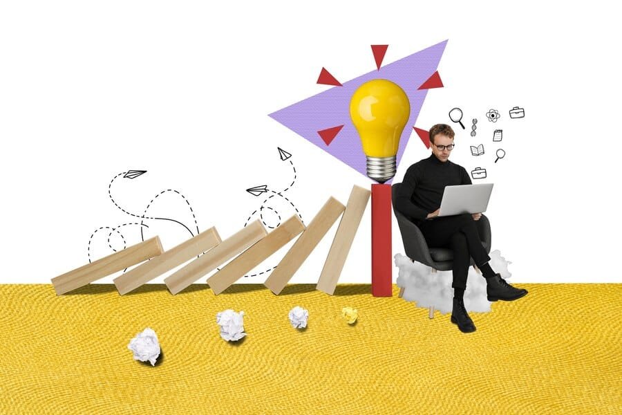 Digital marketing professional with laptop next to glowing lightbulb and rising domino effect symbolizing business growth and innovation