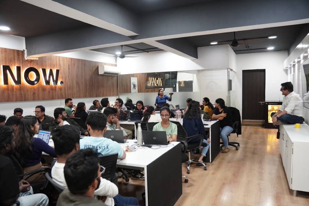 Professional team training session at Digital Mojo Hyderabad office with employees working on laptops