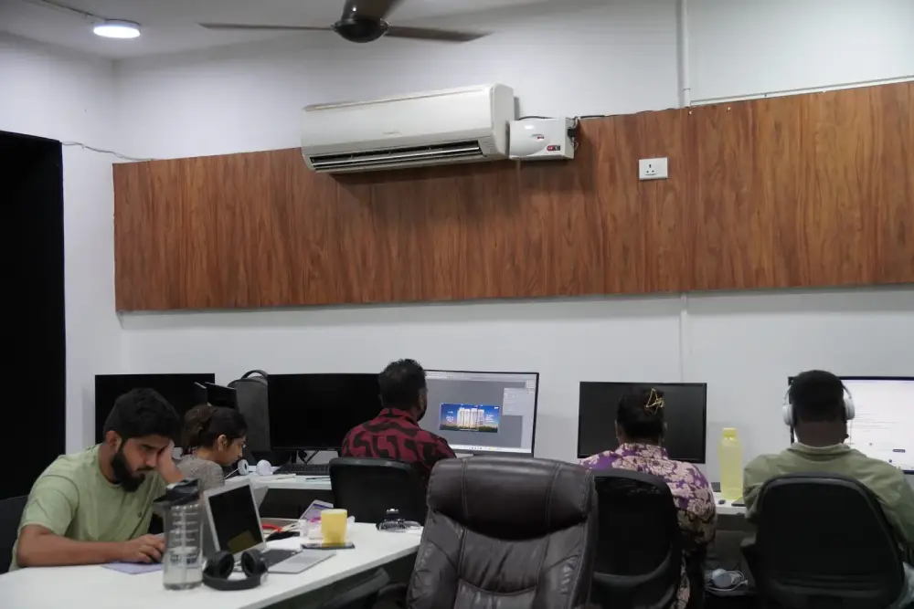 Digital marketing agency team working on computers in modern office with wood paneling and air conditioning