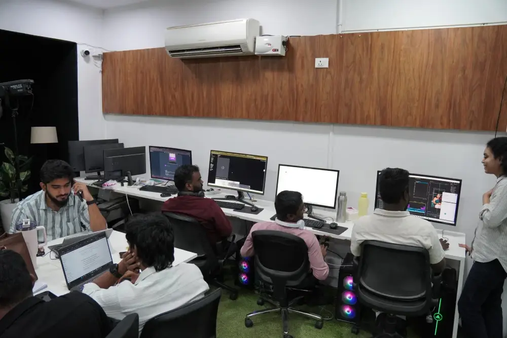 Professional digital marketing team collaborating in modern office with computers and gaming setups