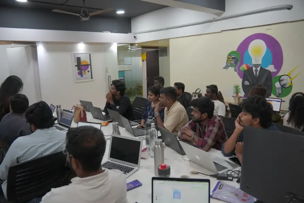 Digital Mojo team collaborating in modern Hyderabad office with laptops and creative workspace designs