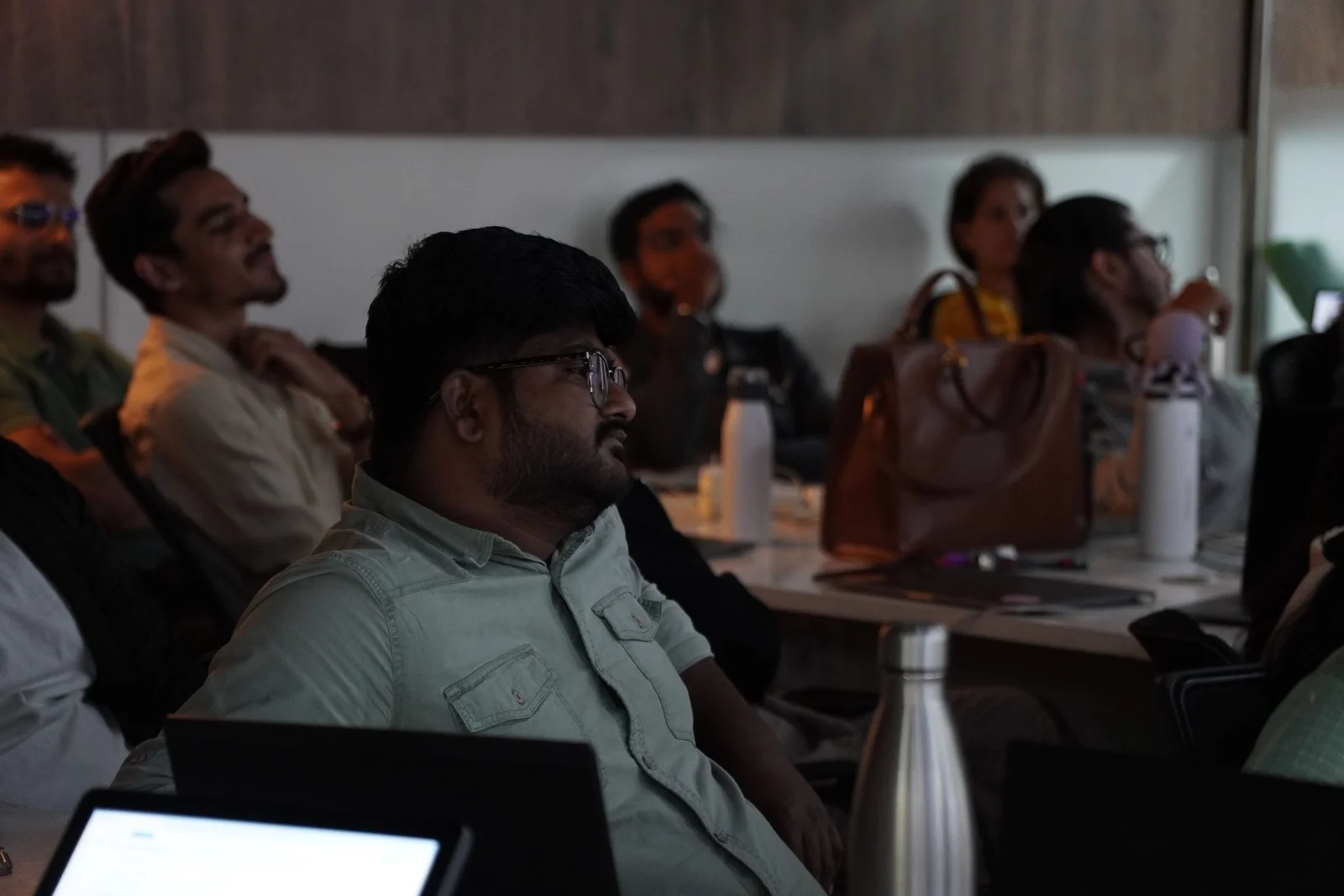 Professional team meeting at Digital Mojo Hyderabad with diverse attendees engaged in business discussion and training session