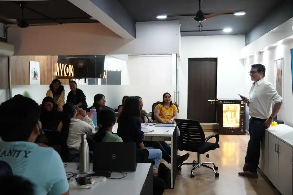 Professional business presentation at Digital Mojo Hyderabad office with team members and presenter discussing digital marketing strategies