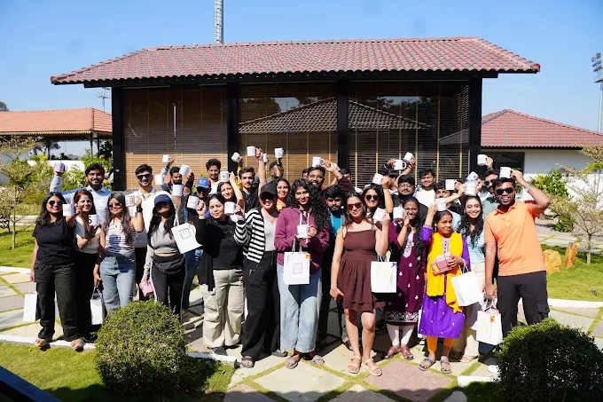 Large diverse group of professionals and attendees gathered outside modern building for corporate event or conference