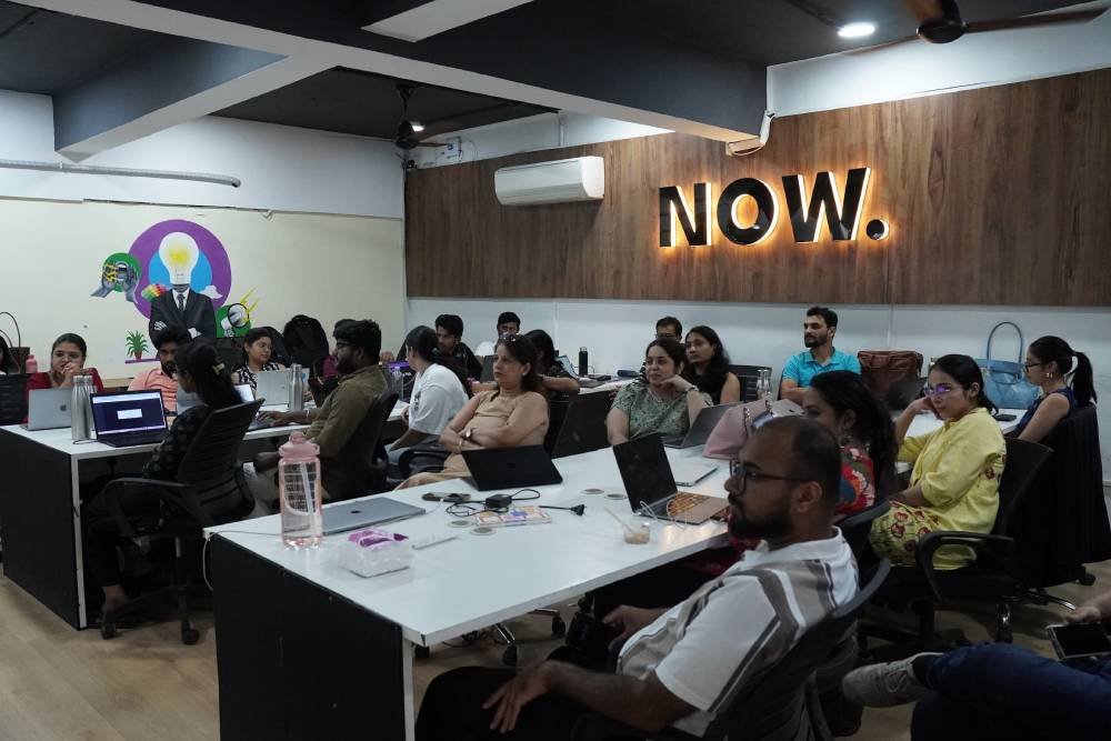 Digital marketing team training session at Digital Mojo Hyderabad office with attendees at collaborative workspace